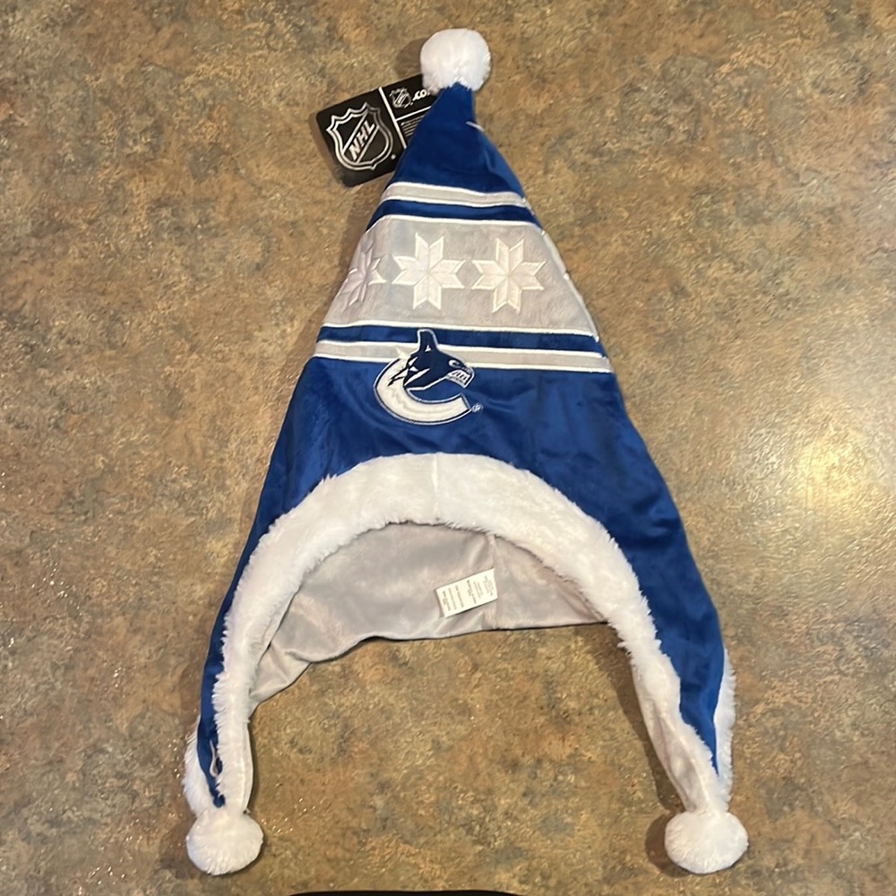 NHL. Vancouver Canucks Santa hat.  Brand is Forever Collectibles.   Unisex.